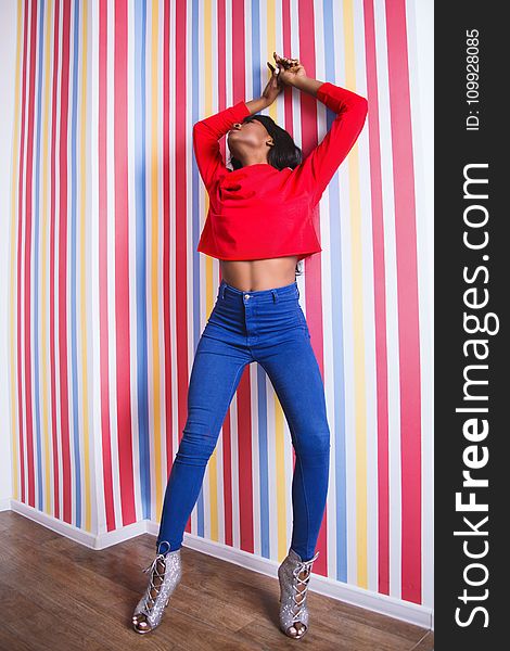 Woman Wearing Long-sleeve Crop-top And Blue Pants