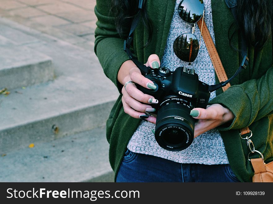 Woman Holding Black Canon Dslr Camera