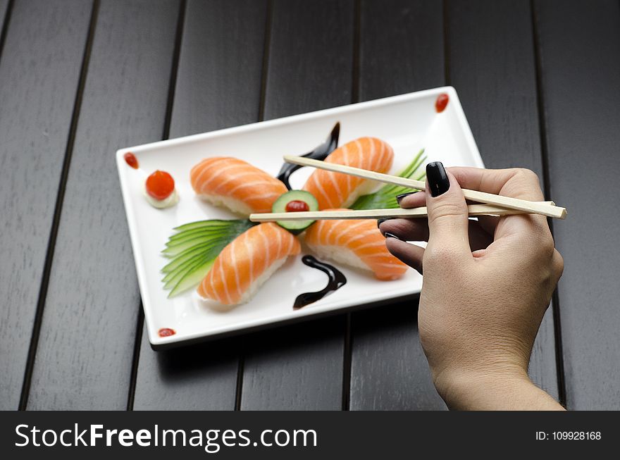 Person Eating Sushi