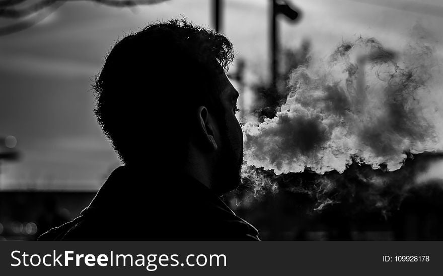 Grayscale Photography of Man Smoking
