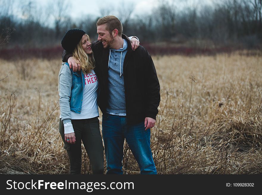 Photo of Couple Near the Field