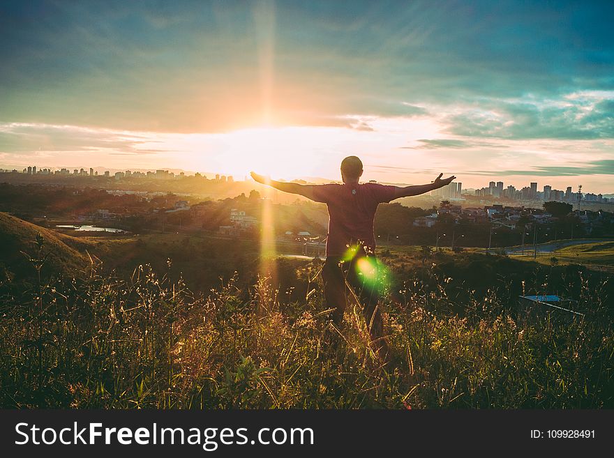 Person Spreading Hands Against Sun