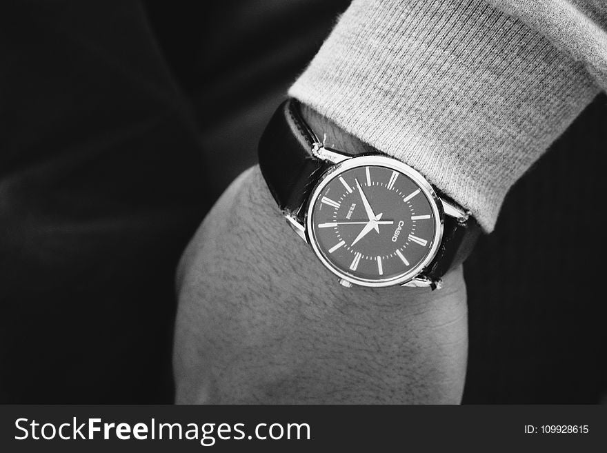 Person Wearing Round Silver Analog Watch With Black Leather Strap