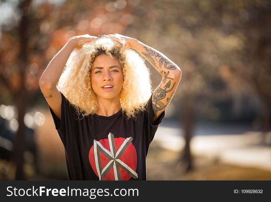 Woman Wearing Black Crew-neck T-shirt