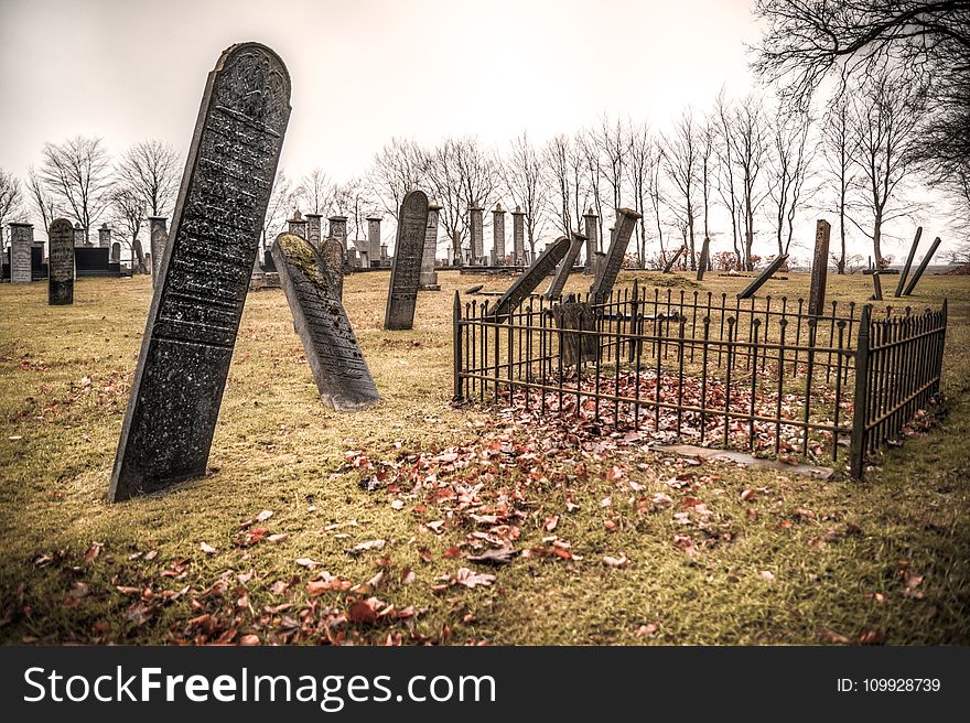 Photography Of Graveyard Under Cloudy Sky