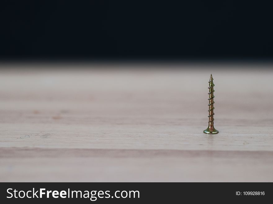 Close-up Photography of a Brass Colored on Top of the Table