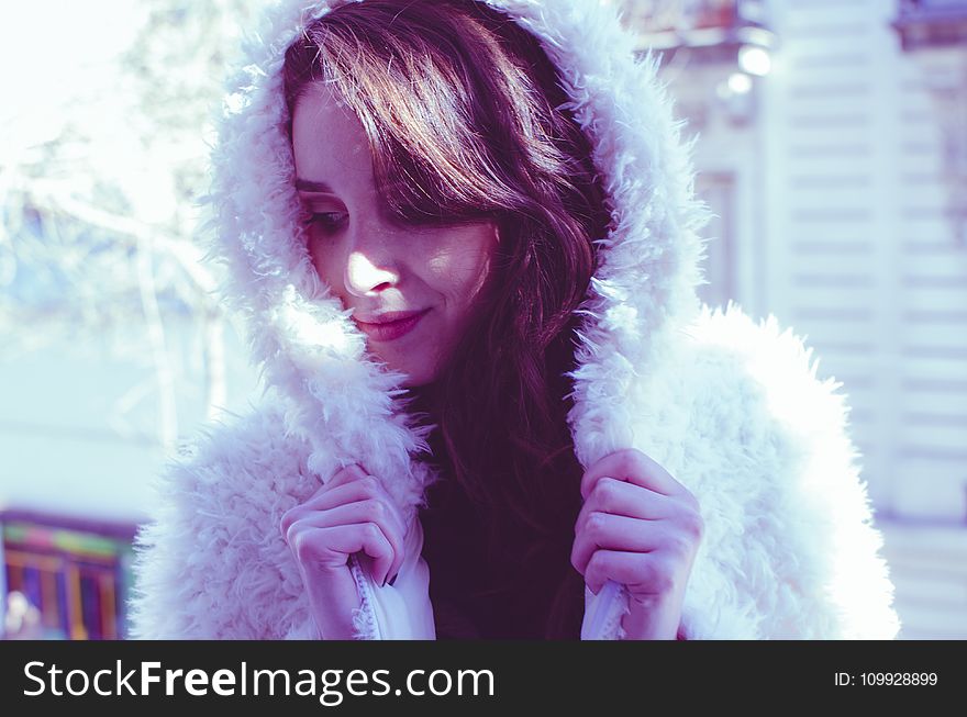 Photography of a Woman in White Fur Coat