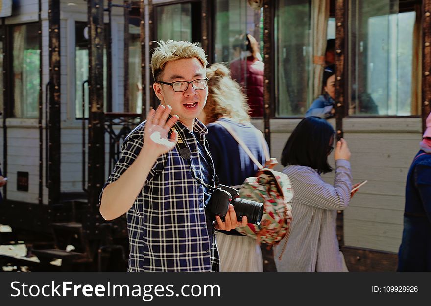 Man With Bridge Camera Waving