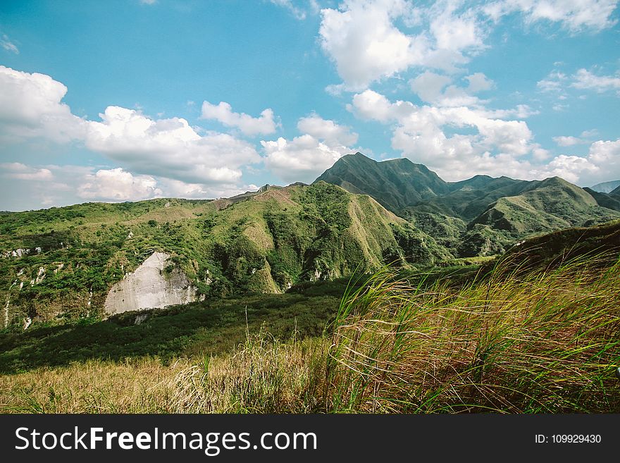 Photo of Mountains Covered with Grass