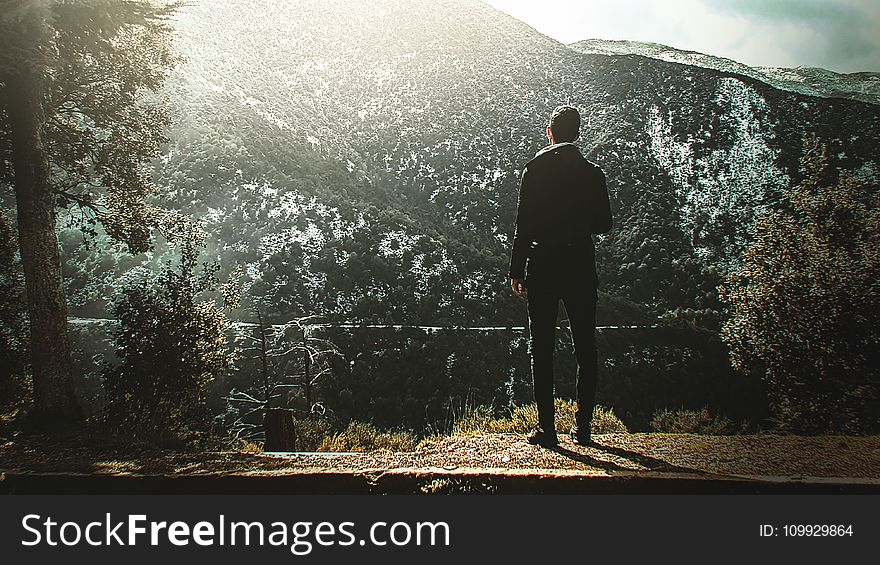 Man Standing On Cliff