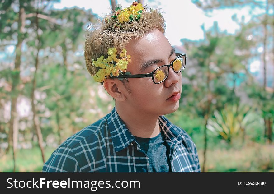 Photo of a Man with Flowers on His Hair