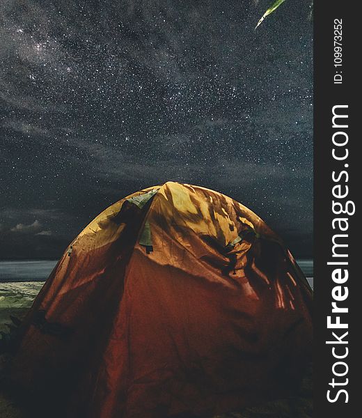 Orange and Green Camping Tent Under Starry Sky