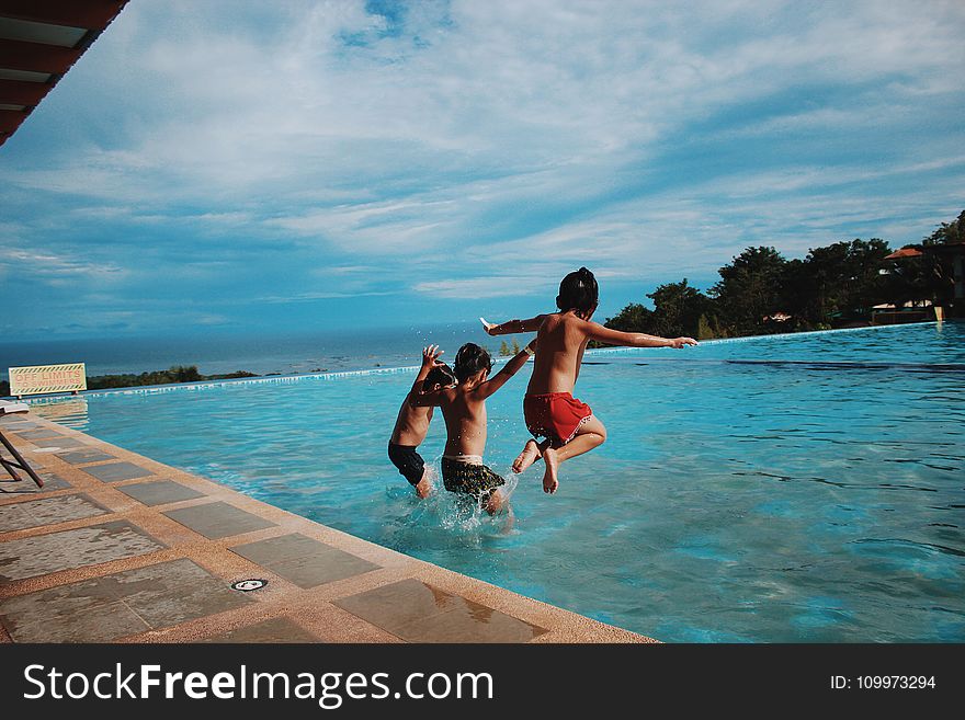 Three Boy&x27;s Jumping Into The Water