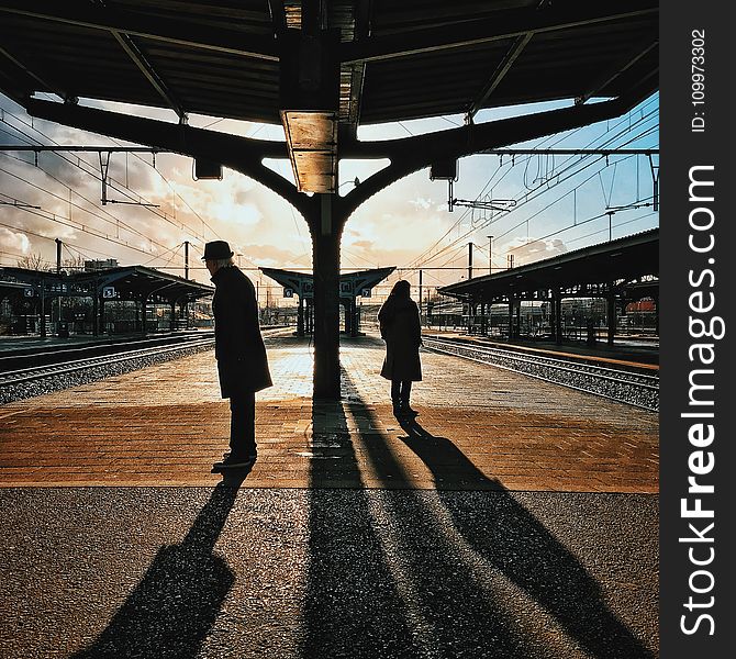 Man And Woman Silhouette Standing On Brown Ground At Daytime