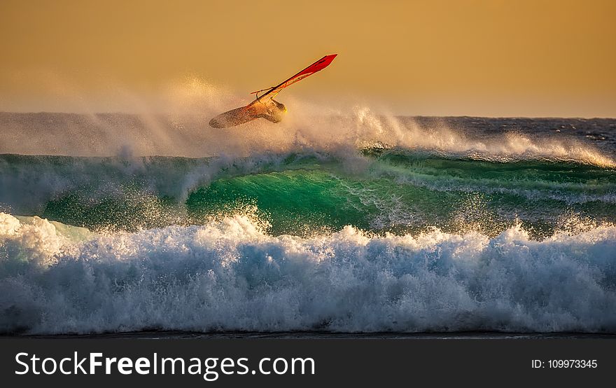 Person Ridding Wind Boat Above Ocean Wave