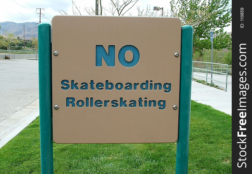 Sign, No skateboarding, rollerskating in public park. Sign, No skateboarding, rollerskating in public park