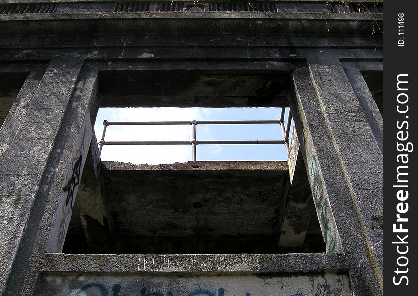 Looking up through a window at a railing on what I believe was the roof of this old building. Part of the ruins of the old Western Washington State Mental Hospital in Steilacoom, WA. Looking up through a window at a railing on what I believe was the roof of this old building. Part of the ruins of the old Western Washington State Mental Hospital in Steilacoom, WA.