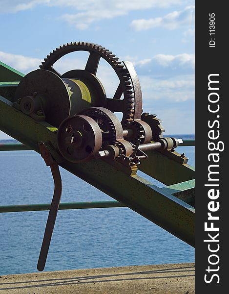 An old rusty winch on a crane