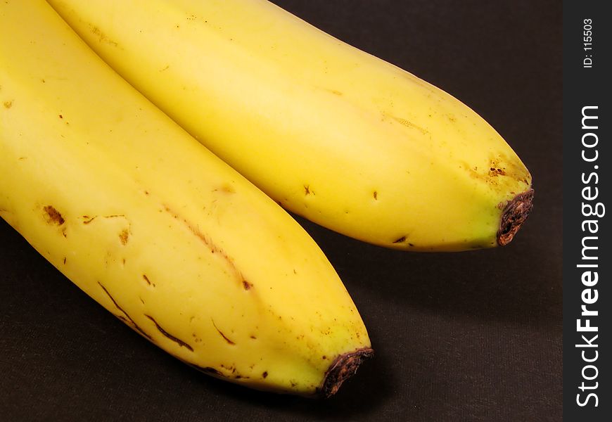 Bananas over black background-Natural,imperfect look.