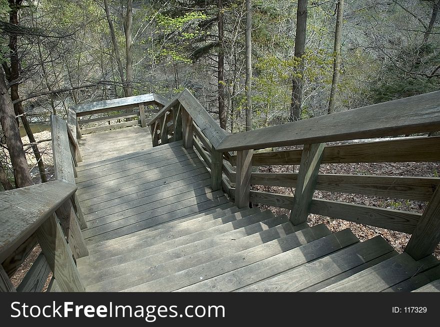 A steep stairway leads down a gorge that would normally be impassable. A steep stairway leads down a gorge that would normally be impassable