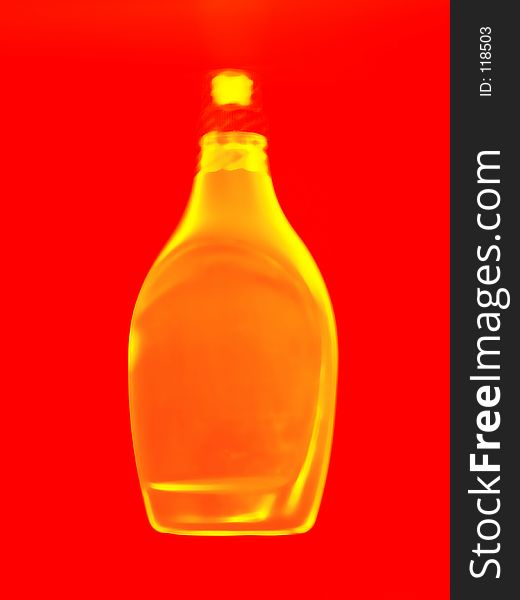 Chocolate syrup bottle abstract over red. Chocolate syrup bottle abstract over red