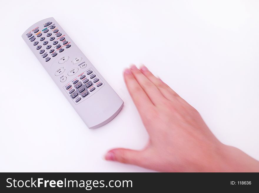 Hand reaching for television remote. Hand reaching for television remote