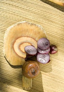Red Onion, A Piece Cut Off With  Board Royalty Free Stock Photography