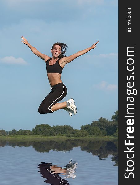 Woman Jumping Above Water