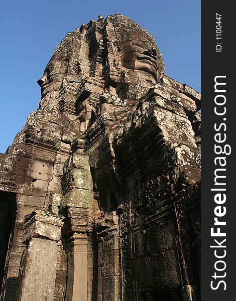 Smiling Stone Faces at Bayon temple, Cambodia.