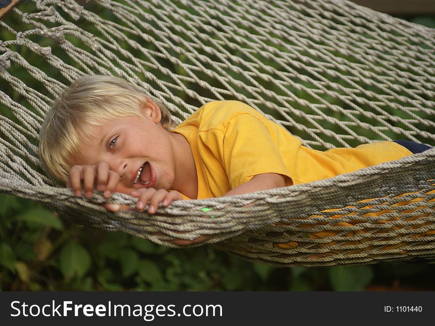 Little boy playing on hammock. Little boy playing on hammock