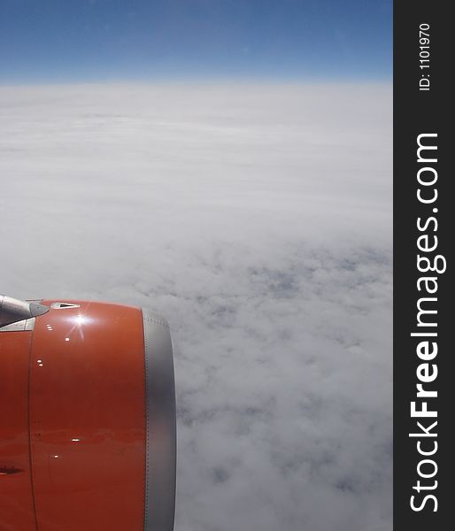 A view over the clouds from a plane. A view over the clouds from a plane
