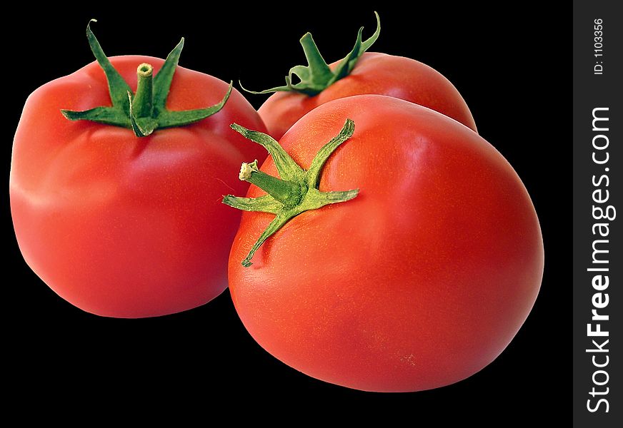 Three tomatoes on black background. Three tomatoes on black background