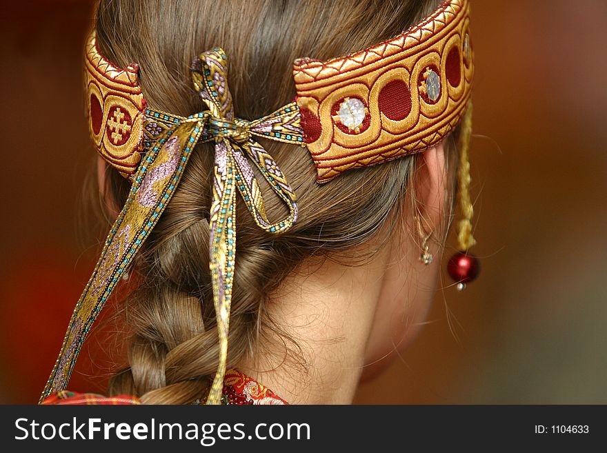 The image of Russian national ornament on a head of the woman