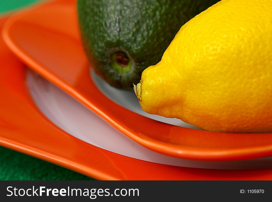 Macro of lemon and avocado on plate