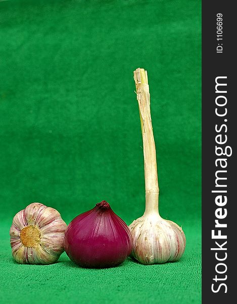Garlic and red onion on green. Garlic and red onion on green