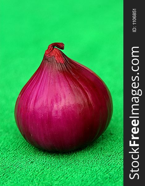 Red onion on green. Red onion on green