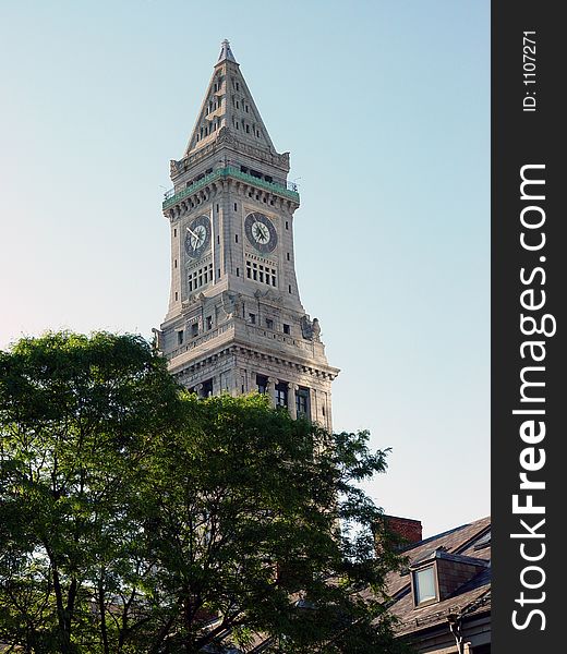 Clock tower in downtown boston against blue, sky, early morning. Clock tower in downtown boston against blue, sky, early morning