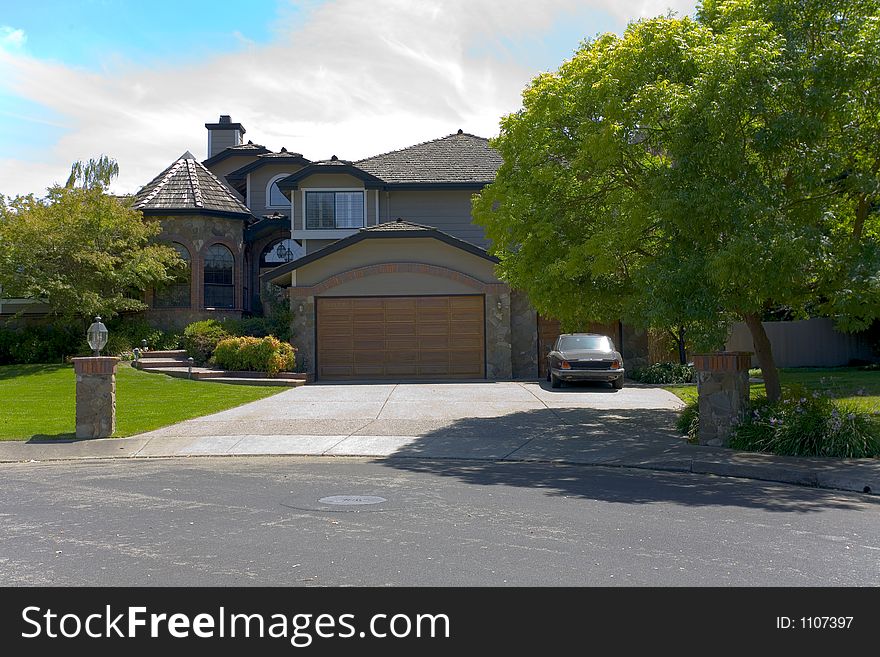 Exterior shot of a tudor home with a turret,