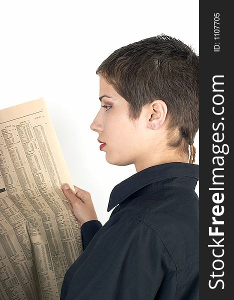 Young businesswoman reading a newspaper. Young businesswoman reading a newspaper