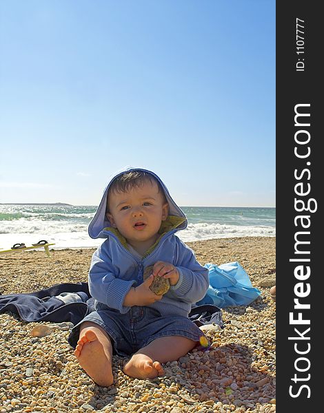 Baby playing at the beach. Baby playing at the beach