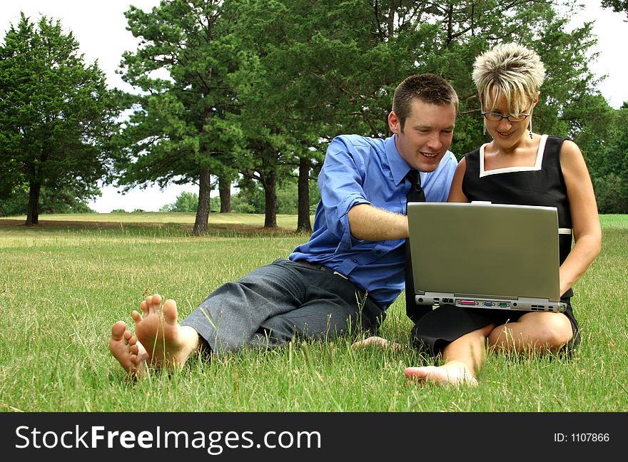 Business team working outdoors with laptop