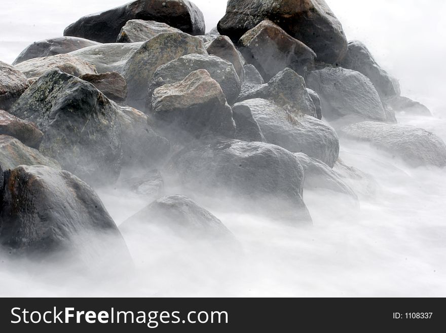 Stones in the water in denmark shot with slow shutter speed. Stones in the water in denmark shot with slow shutter speed