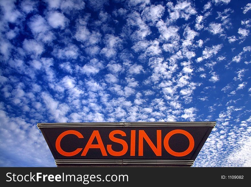 Casino-sign under a deep blue sky with clouds. Casino-sign under a deep blue sky with clouds