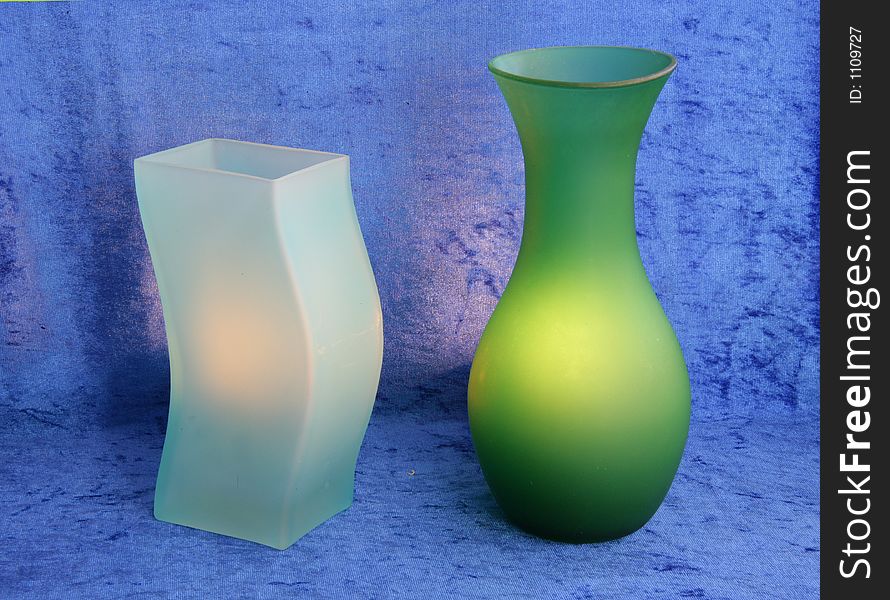 Green vases, blue background. Green vases, blue background