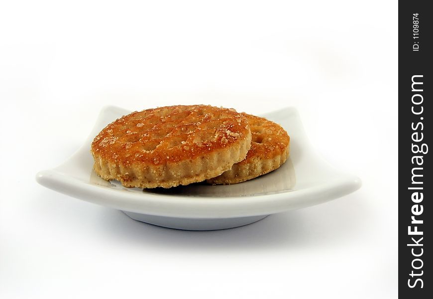 Biscuits on white plate close-up detail