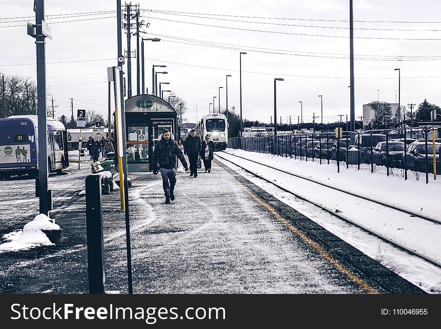 Man Wearing Jacket And Jeans Walking On Road