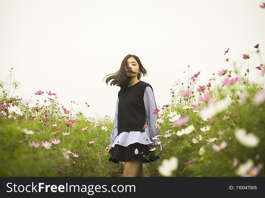 Woman Standing in the Flower Field