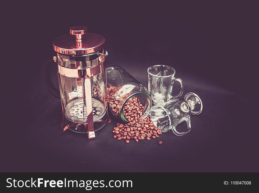 Photograhy of Brown Beans, Clear Glass Mug, and Brass Coffee Grinder