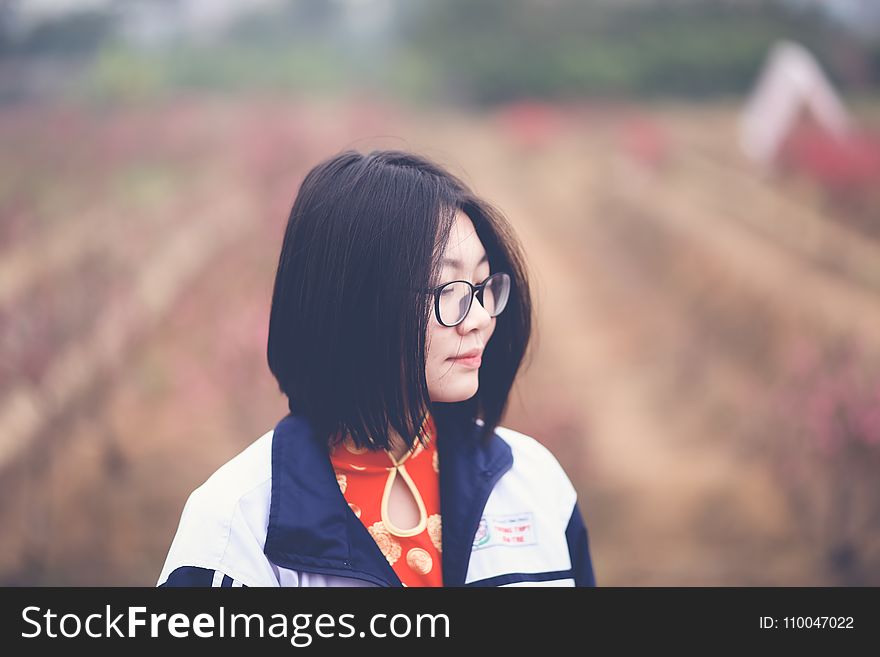 Woman in Black and White Top in Shallow Focus Photography