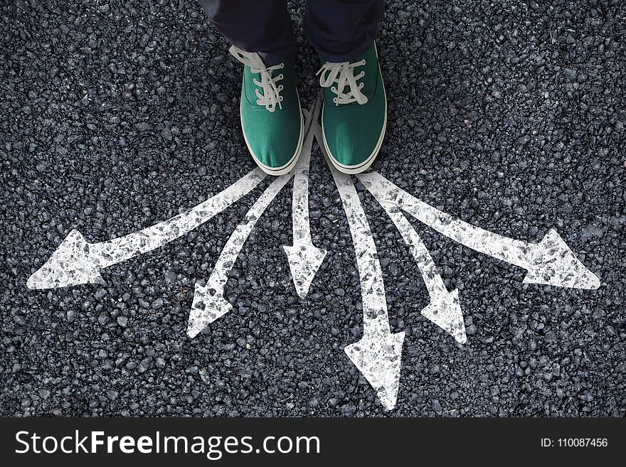 Businessman standing against white background against black road. Businessman standing against white background against black road